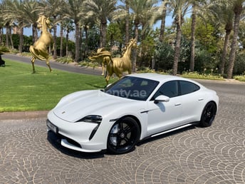White Porsche Taycan Turbo S for rent in Dubai 0