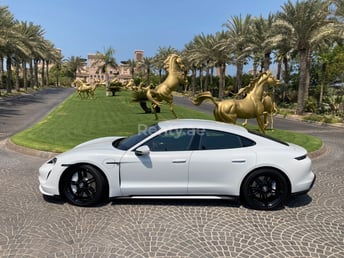 White Porsche Taycan Turbo S for rent in Dubai 1