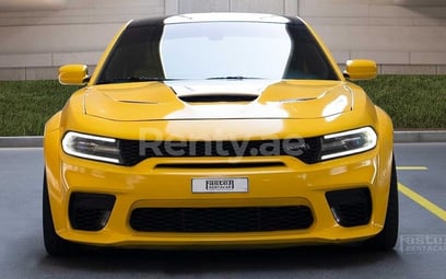 Yellow Dodge Charger for rent in Dubai