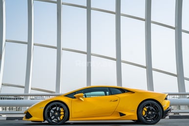 Yellow Lamborghini Huracan Coupe for rent in Dubai 2