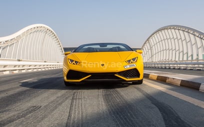 Yellow Lamborghini Huracan Spyder for rent in Dubai 0