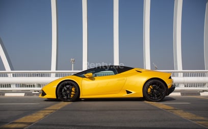Yellow Lamborghini Huracan Spyder for rent in Abu-Dhabi 1