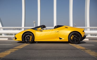 Yellow Lamborghini Huracan Spyder for rent in Dubai 2