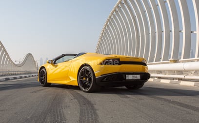 Yellow Lamborghini Huracan Spyder for rent in Dubai 3