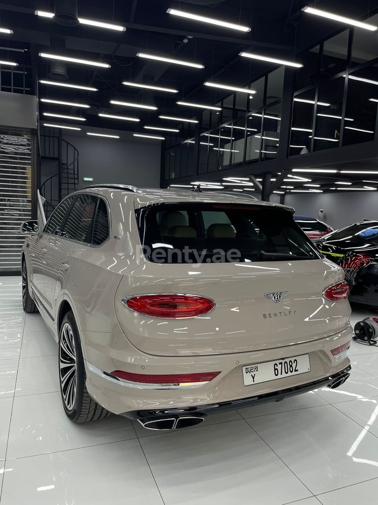 Beige Bentley Bentayga for rent in Dubai 0