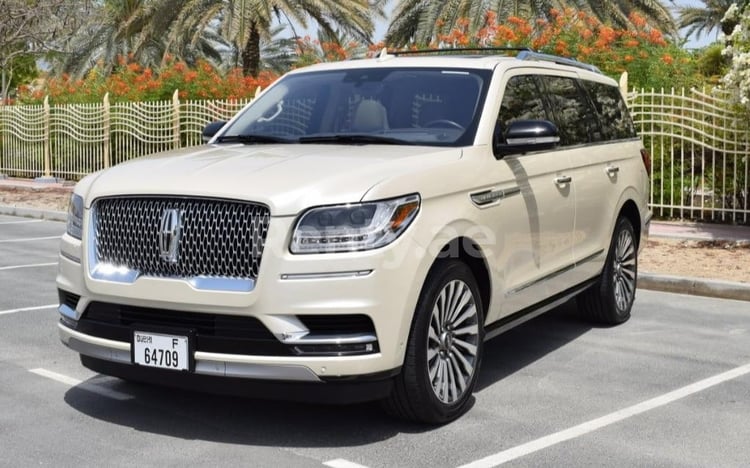 Beige Lincoln Navigator for rent in Sharjah