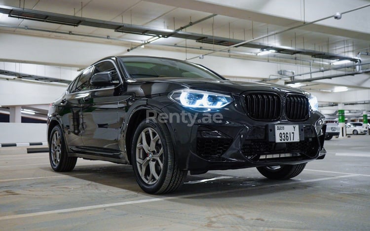 Black 2020 BMW X4 with X4M Body Kit for rent in Dubai