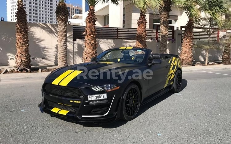 Black Ford Mustang V8 cabrio for rent in Abu-Dhabi