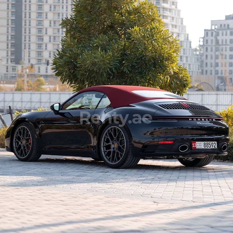 Black Porsche 911 Carrera 4s cabrio for rent in Dubai 0