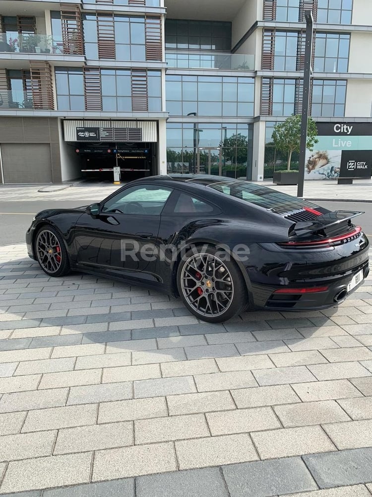 Black Porsche 911 Carrera S for rent in Dubai 0