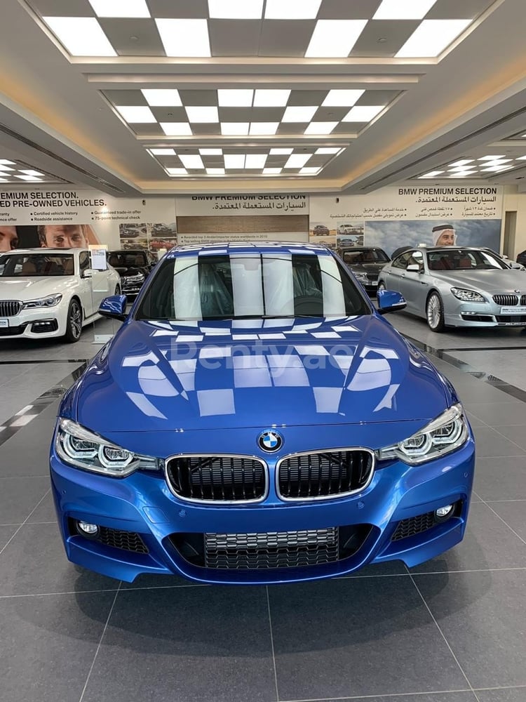 Blue BMW 318 for rent in Sharjah 0