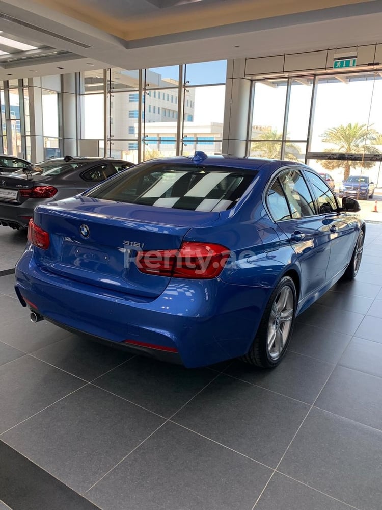 Blue BMW 318 for rent in Dubai 2