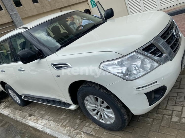 Bright White Nissan Patrol for rent in Sharjah 0