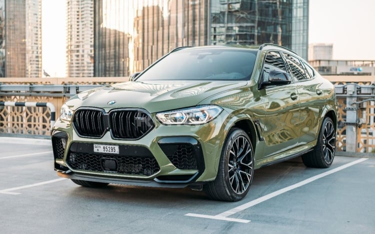 Green BMW X6 M Competition for rent in Dubai