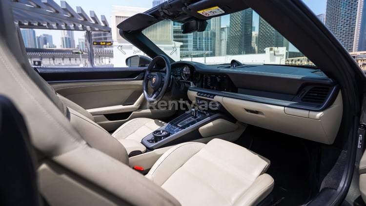 Grey Porsche 911 Carrera Cabrio for rent in Sharjah 3