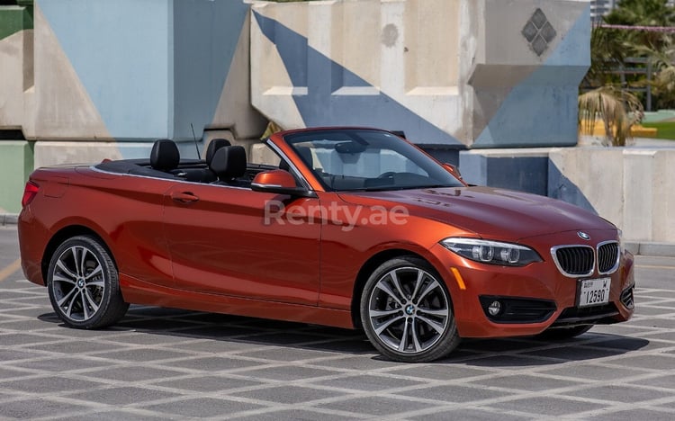 Orange BMW 230i for rent in Dubai