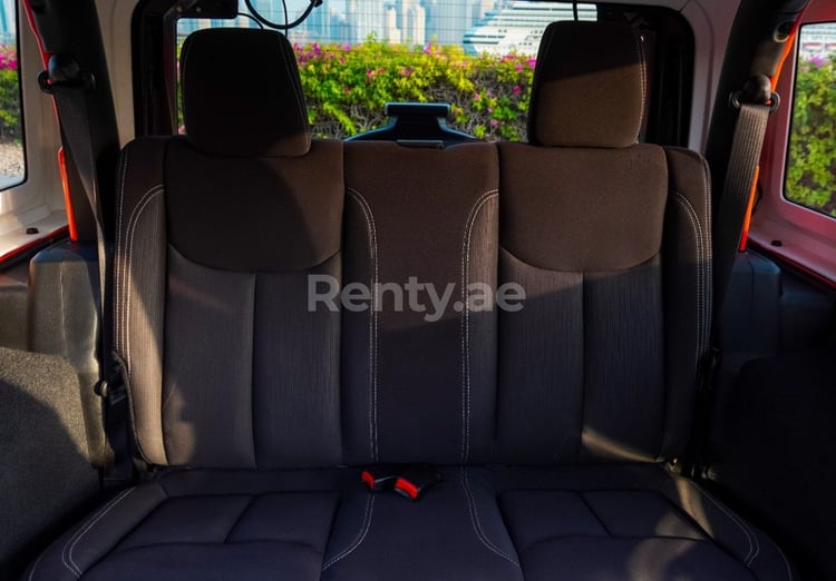 Orange Jeep Wrangler for rent in Sharjah 2