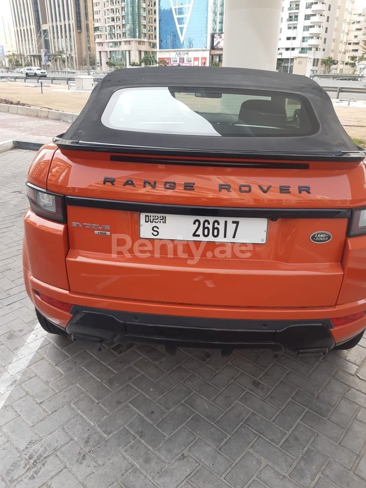 Orange Range Rover Evoque for rent in Dubai 1