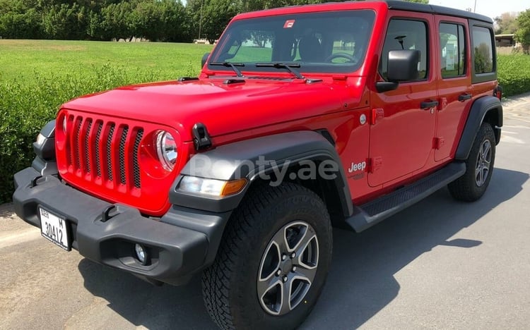 Rouge Jeep Wrangler en location à Abu-Dhabi