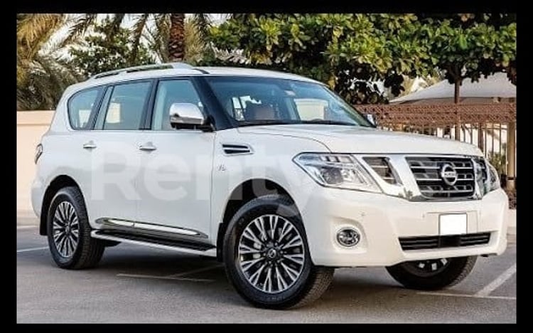 Bright White Nissan Patrol for rent in Sharjah