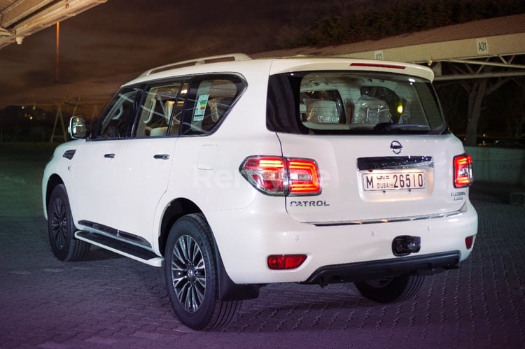 Bright White Nissan Patrol for rent in Abu-Dhabi 3