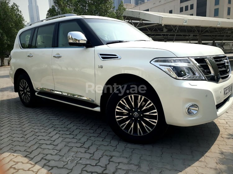 Bright White Nissan Patrol for rent in Sharjah 7