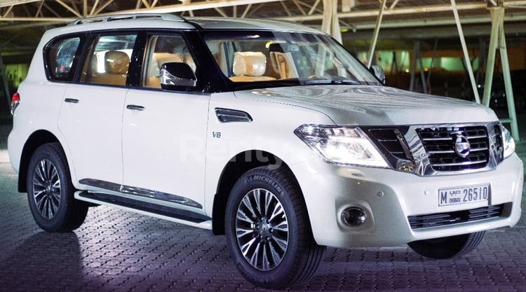 Bright White Nissan Patrol for rent in Sharjah