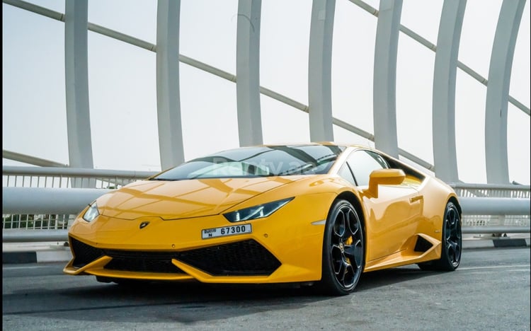 Yellow Lamborghini Huracan Coupe for rent in Dubai