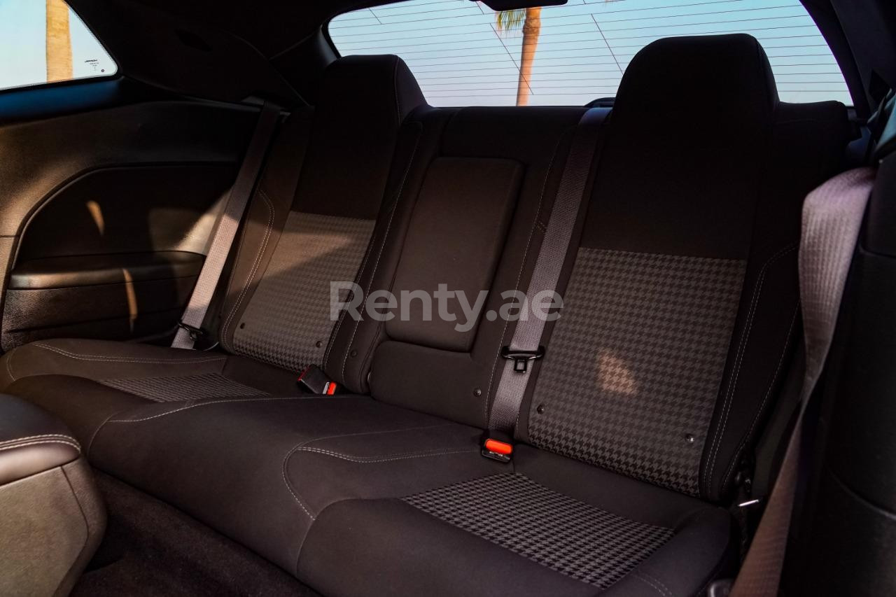 Orange Dodge Challenger for rent in Dubai 4