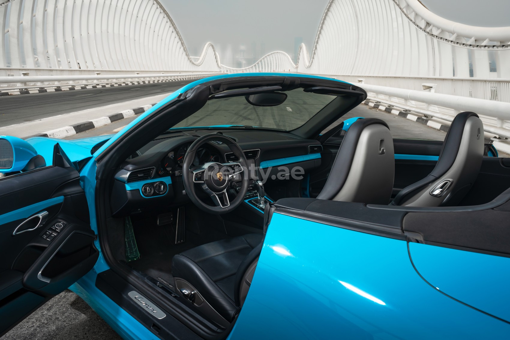 Blue Porsche 911 Carrera cabrio for rent in Sharjah 4