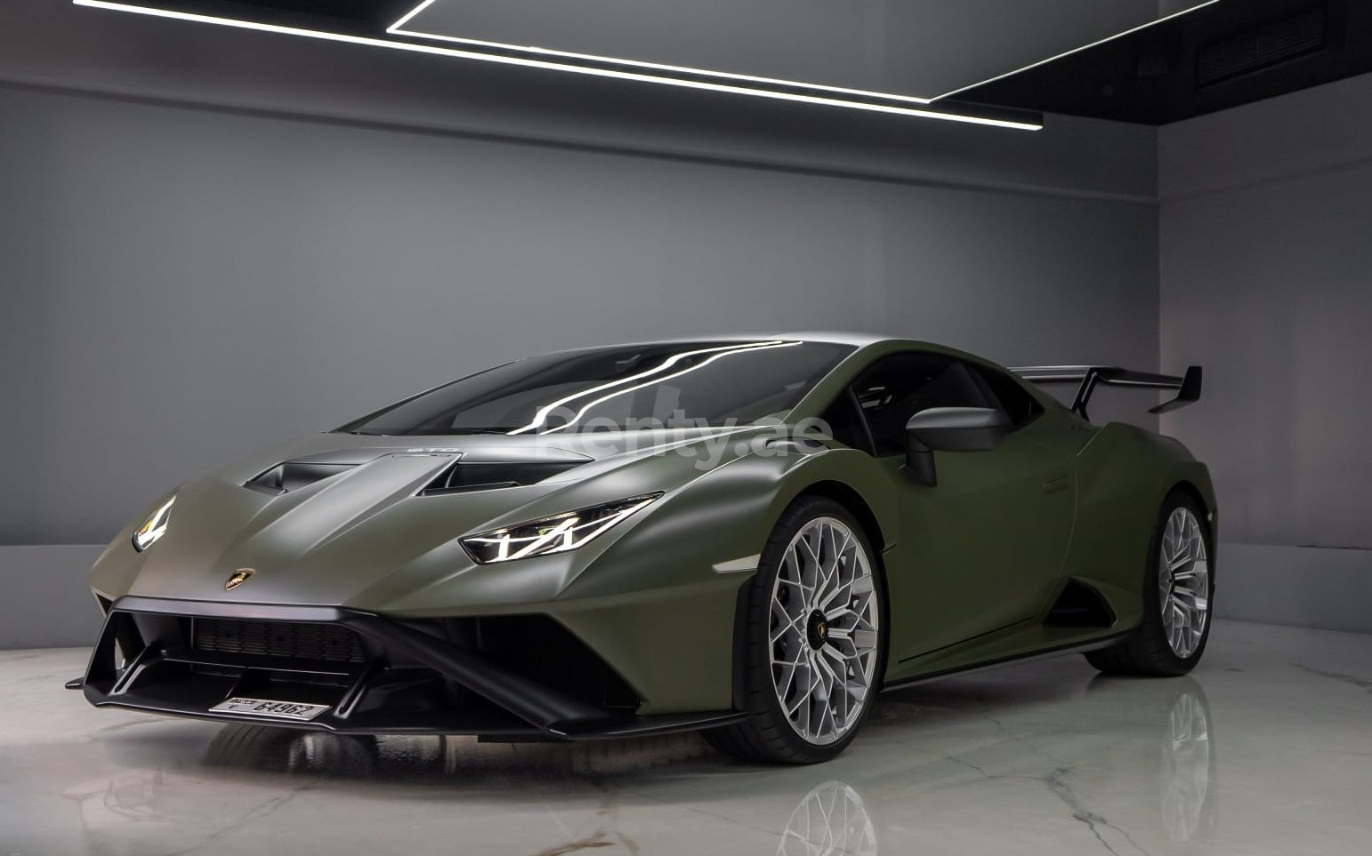 Green Lamborghini Huracan STO for rent in Dubai