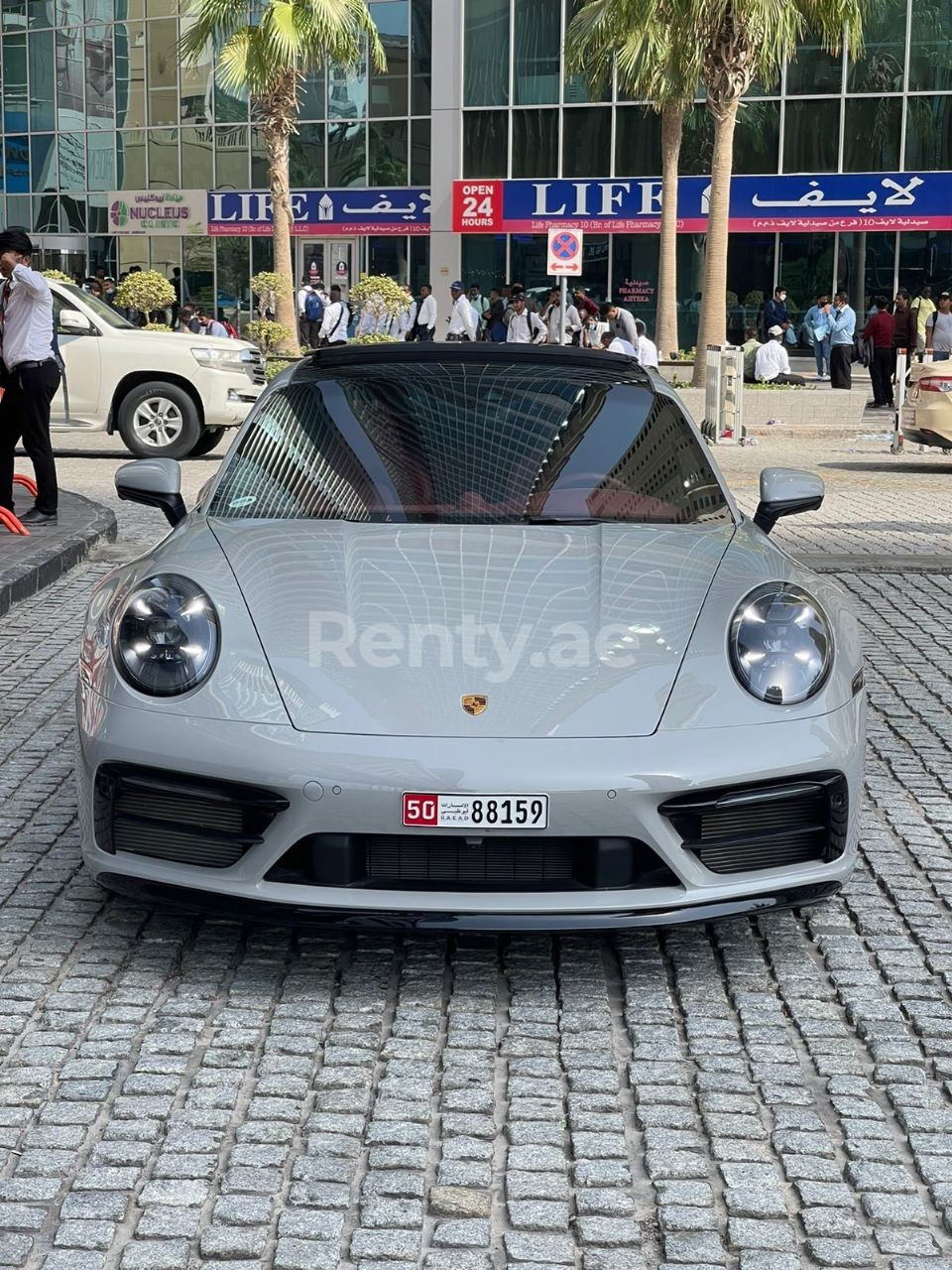 Grey Porsche 911 Carrera 4s cabrio for rent in Sharjah 0