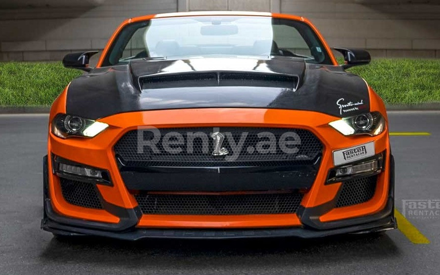 Orange Ford Mustang for rent in Dubai