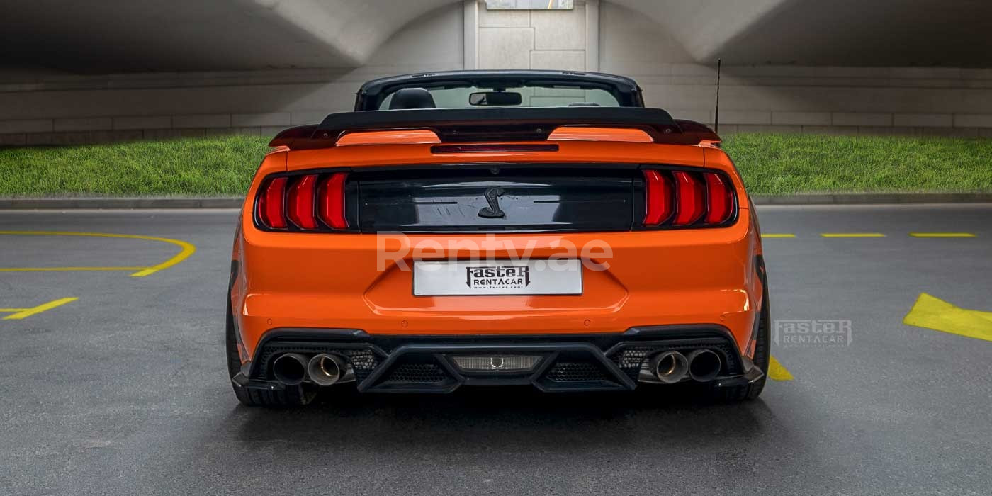 Orange Ford Mustang for rent in Dubai 3