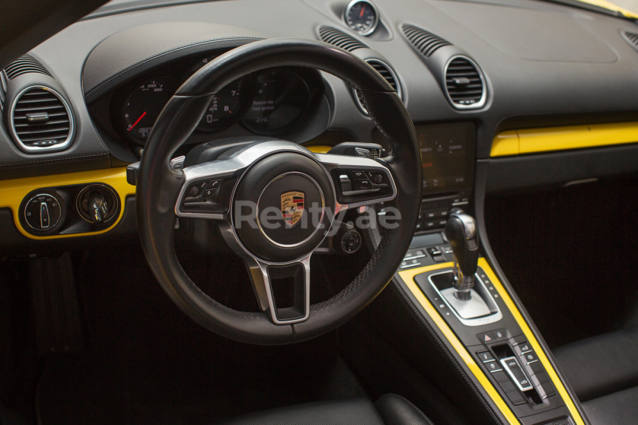 Yellow Porsche Boxster 718 for rent in Dubai 4