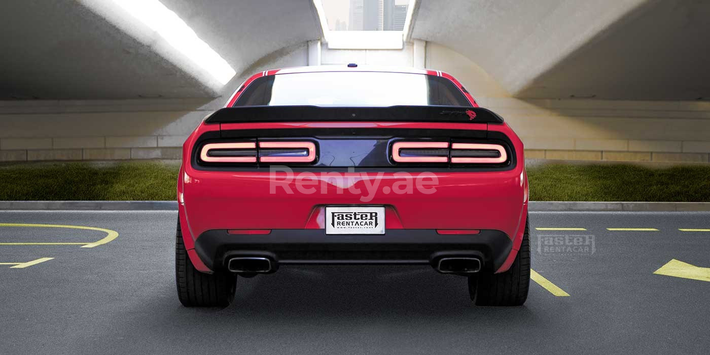 Red Dodge Challenger for rent in Dubai 3