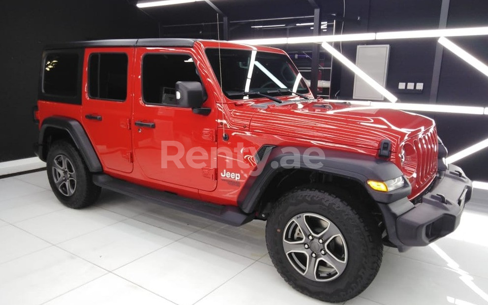 Red Jeep Wrangler for rent in Sharjah