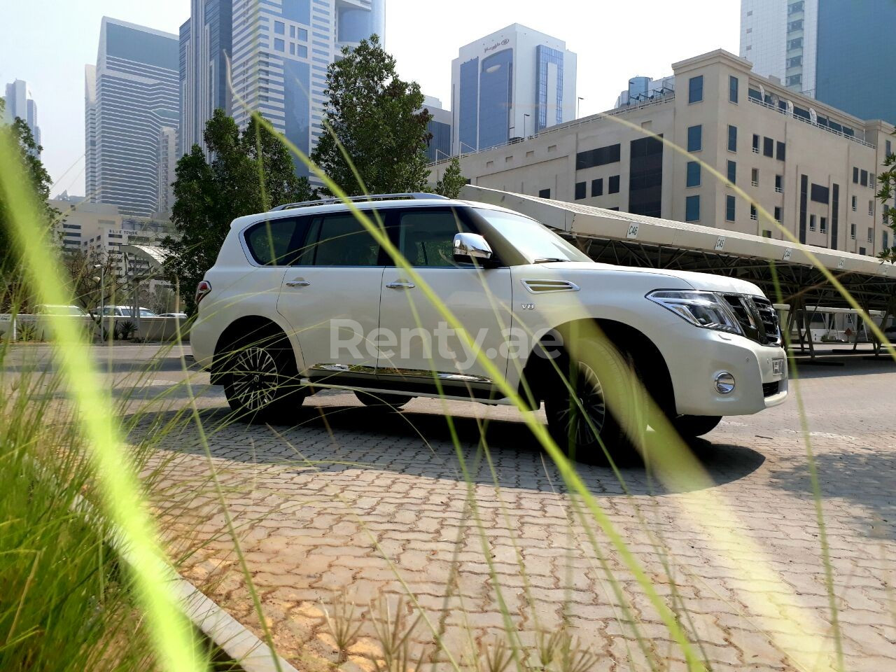 Bright White Nissan Patrol for rent in Dubai 6