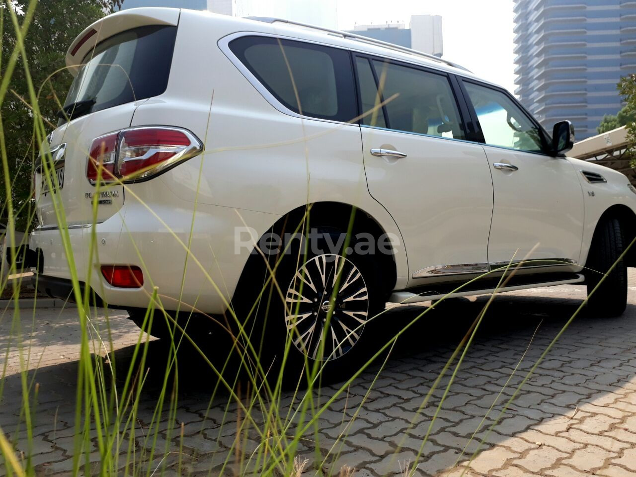 Bright White Nissan Patrol for rent in Dubai 10