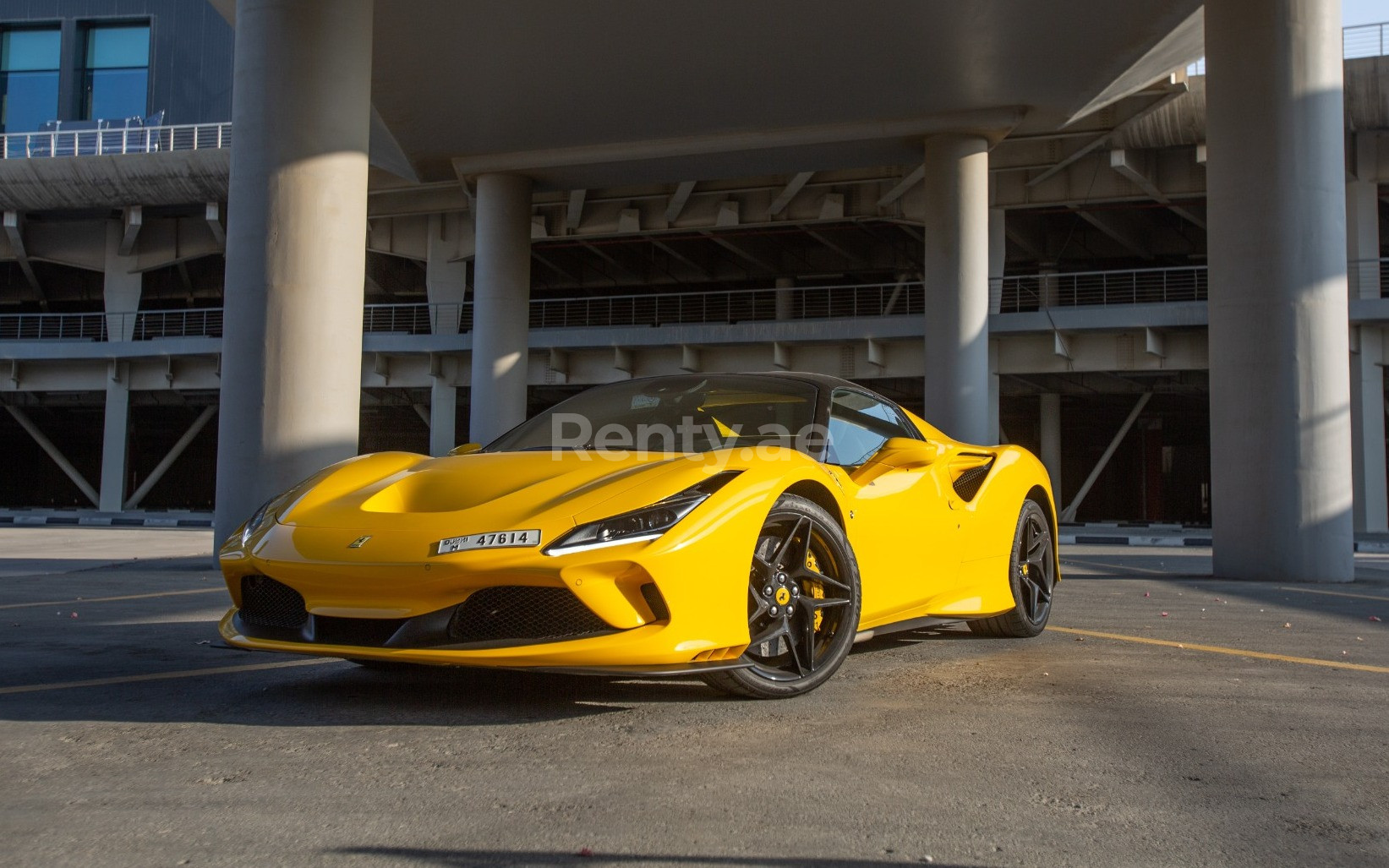 Yellow Ferrari F8 Tributo Spyder for rent in Abu-Dhabi